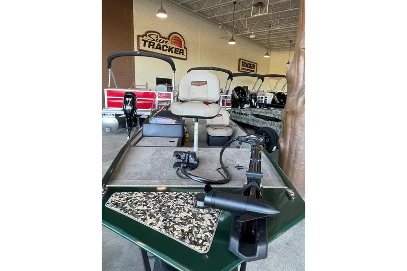 Slide: The Image of 2026 Tracker Bass Tracker Classic Limited boat in showroom, featuring comfortable seating and advanced equipment. - 2