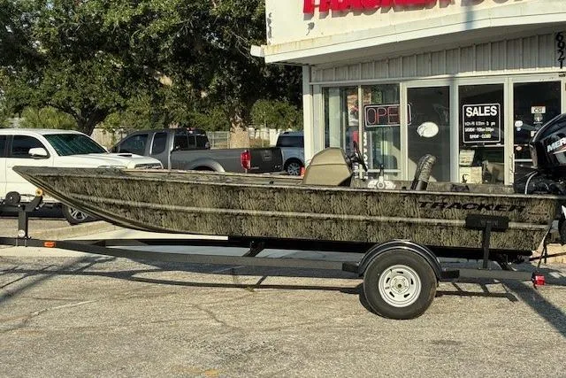 The Image of 2026 Tracker Grizzly 1754 SC boat on trailer outside dealership. - 0