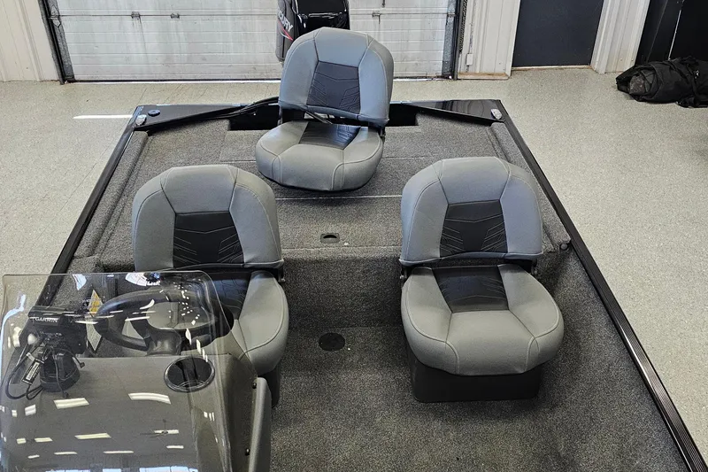 Slide: The Image of 2026 Tracker Bass Tracker Classic XL boat interior with three gray seats. - 6