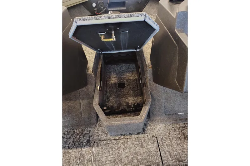 Slide: The Image of Open storage compartment in 2026 Tracker Targa V-18 Combo boat interior. - 8