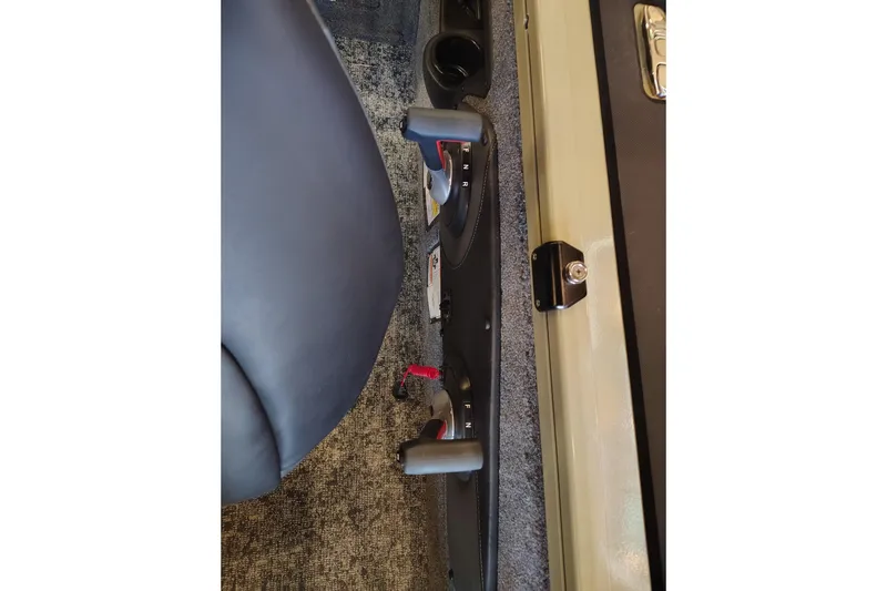 Slide: The Image of Interior view of 2026 Tracker Targa V-18 Combo boat controls and seating. - 9