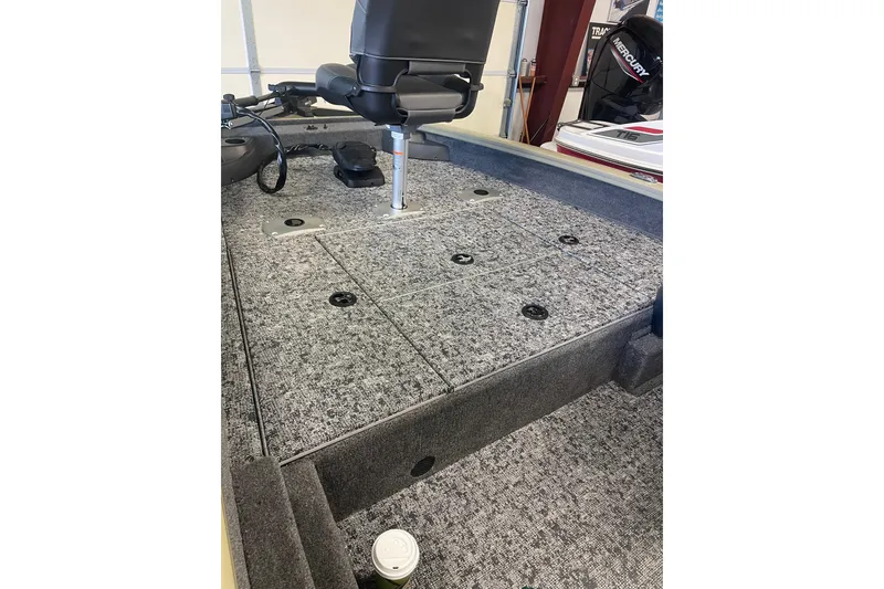 Slide: The Image of 2026 Tracker Pro Team 175 Crappie Edition boat interior with carpeted deck and seating. - 6