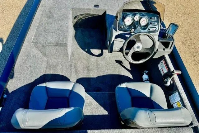 Slide: The Image of 2026 Tracker Pro 170 boat interior with dual seats and steering console. - 5