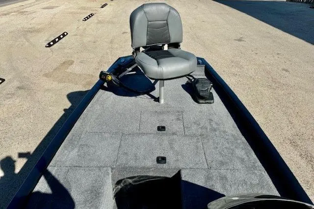 Slide: The Image of 2026 Tracker Pro 170 boat interior with gray seating and carpeted deck. - 6