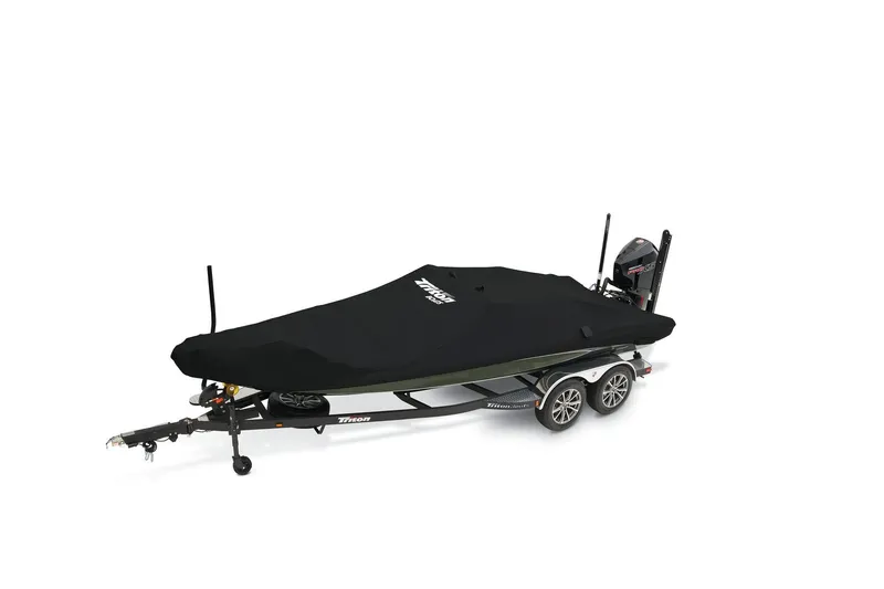 Slide: The Image of 2025 Triton 20XP boat on trailer at dealership, cloudy sky background. - 4