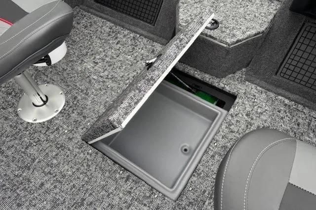 Slide: The Image of 2026 Tracker Targa V-19 Combo boat interior with open storage compartment. - 19