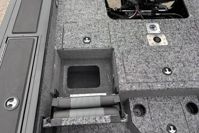 Slide: The Image of 2026 Tracker Targa V-19 Combo boat interior with storage compartments and seating. - 26