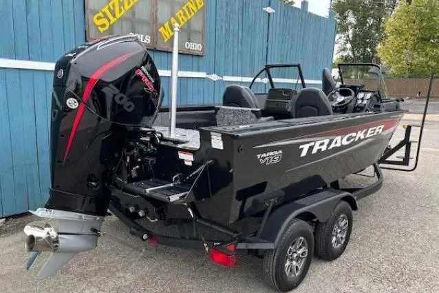 Slide: The Image of 2026 Tracker Targa V-19 Combo boat with powerful outboard motor, parked on a trailer. - 3