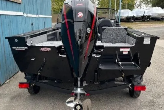 Slide: The Image of 2026 Tracker Targa V-19 Combo boat, rear view, parked outdoors. - 4
