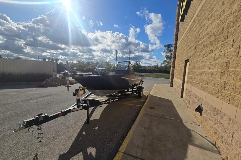 Slide: The Image of 2026 Tracker Pro Guide V-175 WT boat on trailer under sunny sky. - 70