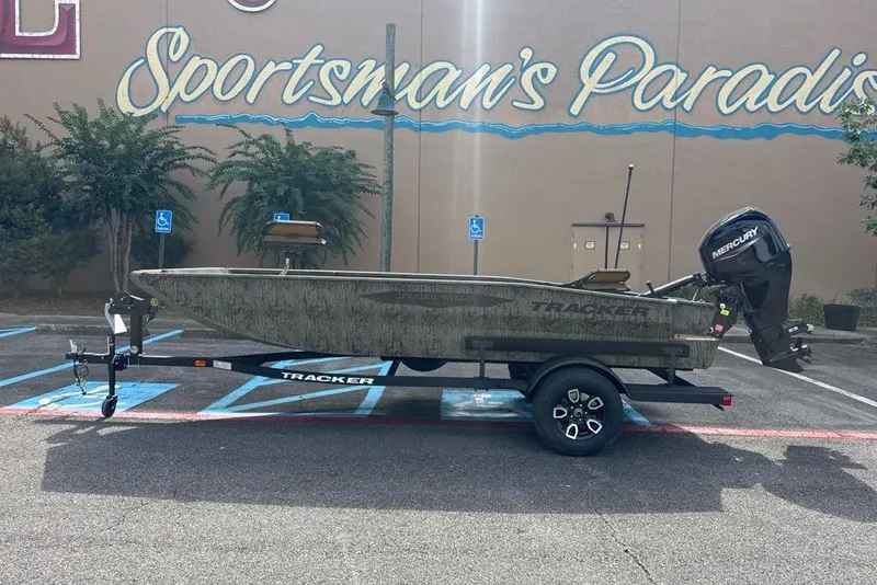 The Image of 2026 Tracker Grizzly 1650 T Prairie Wings Edition boat on trailer in parking lot. - 0