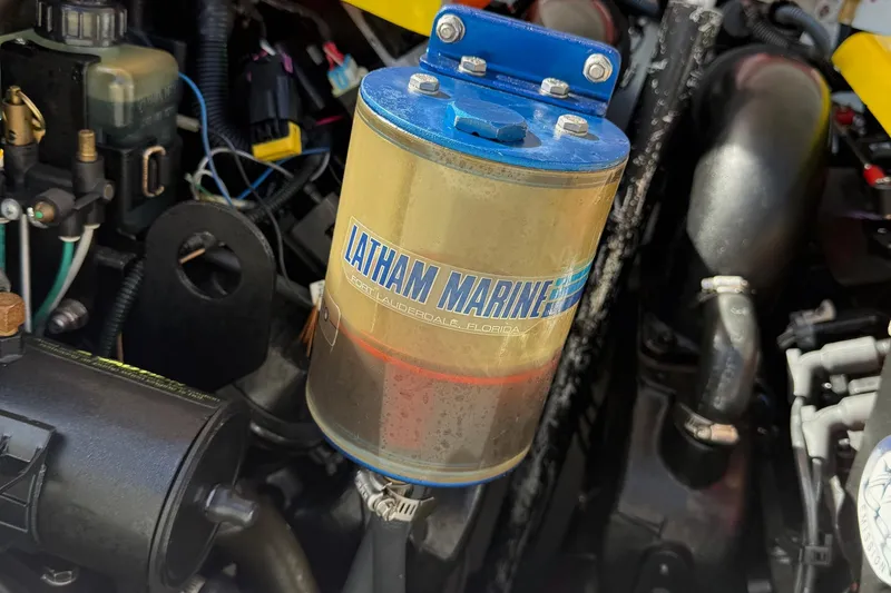 Slide: The Image of Engine compartment of a 2005 Baja 30 Outlaw featuring a Latham Marine component. - 12
