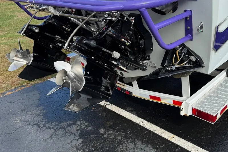 Slide: The Image of 2005 Baja 30 Outlaw boat with dual propellers on a trailer. - 9