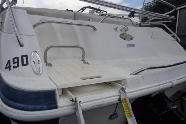 Slide: The Image of 2000 Harris-Kayot 226 Super Deck boat rear view with swim platform and ladder. - 3