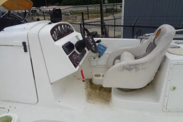 Slide: The Image of 2000 Harris-Kayot 226 Super Deck boat interior with steering wheel and control panel. - 6