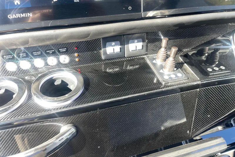 Slide: The Image of Control panel of 2025 Nor-Tech 450 Sport Center Console with carbon fiber finish and Garmin display. - 29