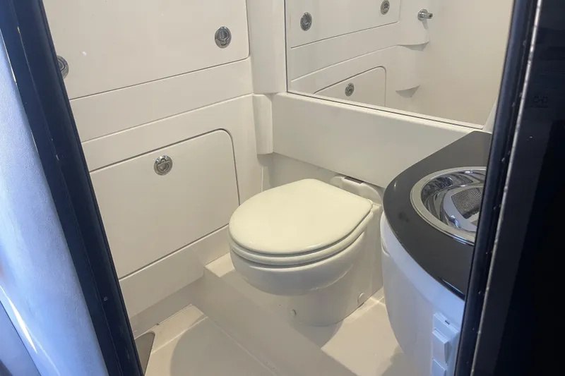 Slide: The Image of 2025 Nor-Tech 450 Sport Center Console bathroom interior with modern fixtures. - 42