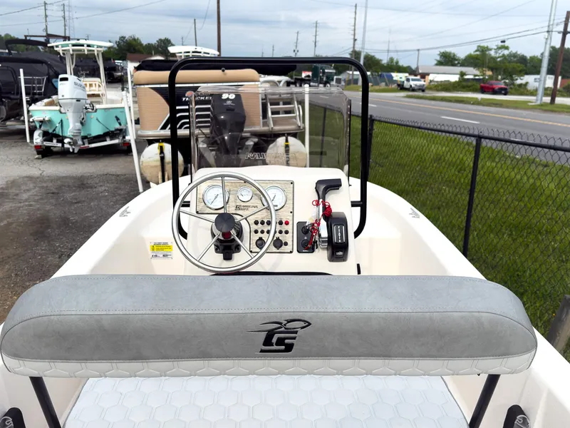 Slide: The Image of 2025 Carolina Skiff 16 JVX CC boat interior with steering console and controls. - 7