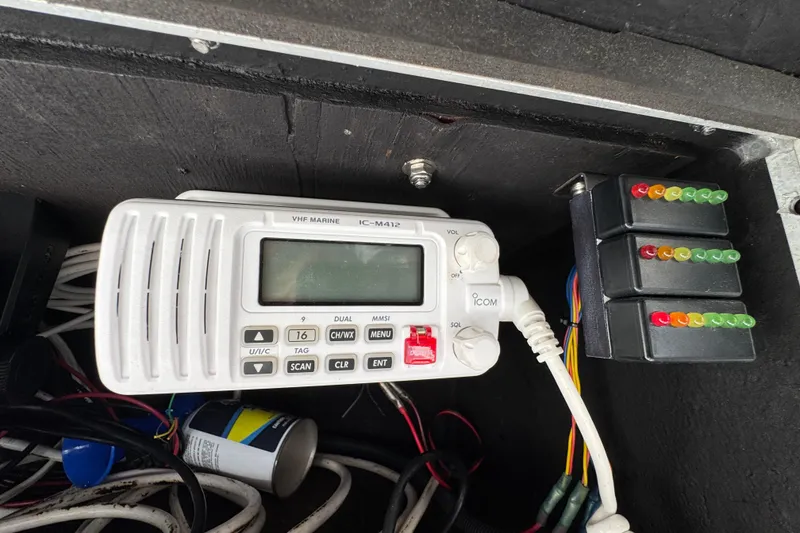 Slide: The Image of VHF marine radio and wiring inside 1986 Luhrs Tournament 290 boat. - 20