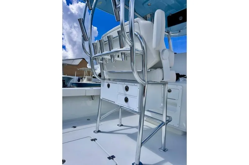 Slide: The Image of 2026 Pair Customs 24 Center Console DV boat interior with sleek seating and storage. - 12