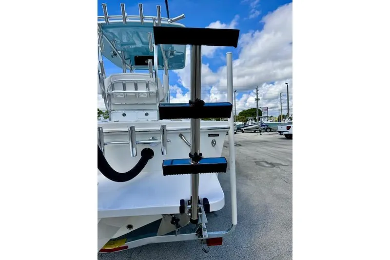Slide: The Image of 2026 Pair Customs 24 Center Console DV boat with rear ladder and rod holders. - 14