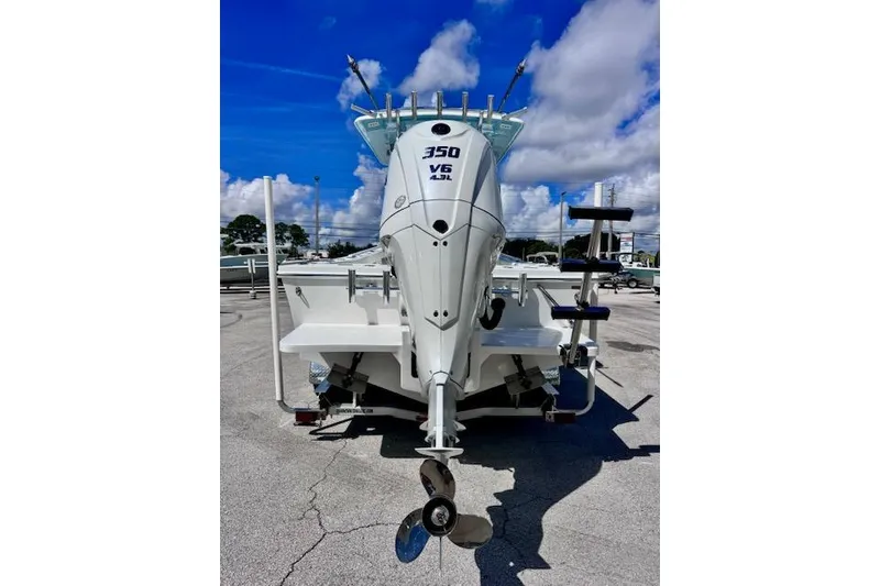 Slide: The Image of 2026 Pair Customs 24 Center Console DV boat with 350 V6 engine, rear view. - 4