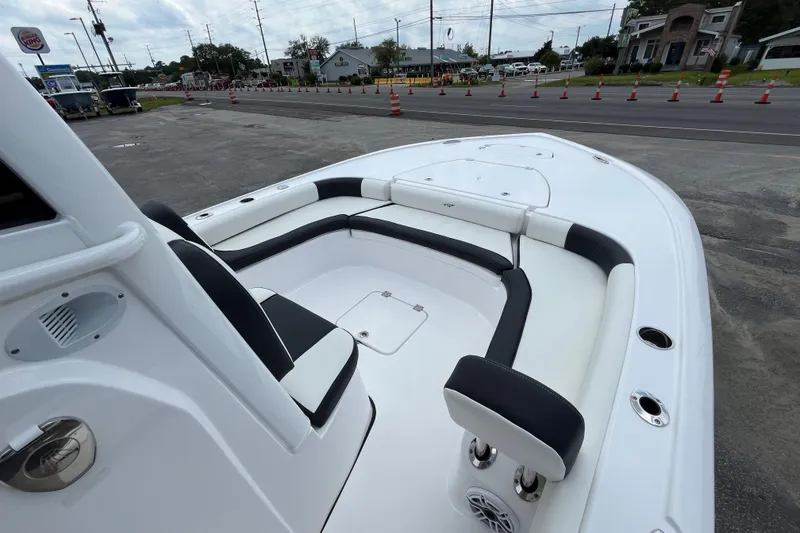 Slide: The Image of 2023 Tidewater 2500 Carolina Bay boat interior with sleek seating and modern design. - 11