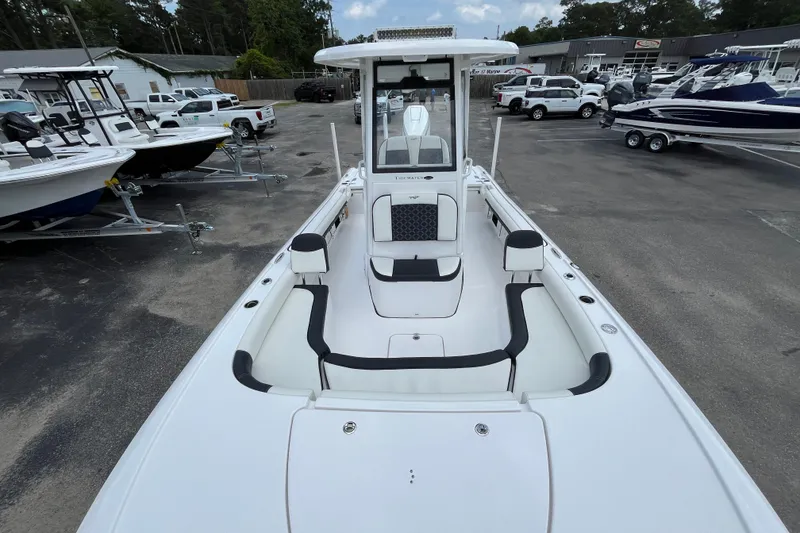 Slide: The Image of 2023 Tidewater 2500 Carolina Bay boat in dealership lot, showcasing spacious interior design. - 12