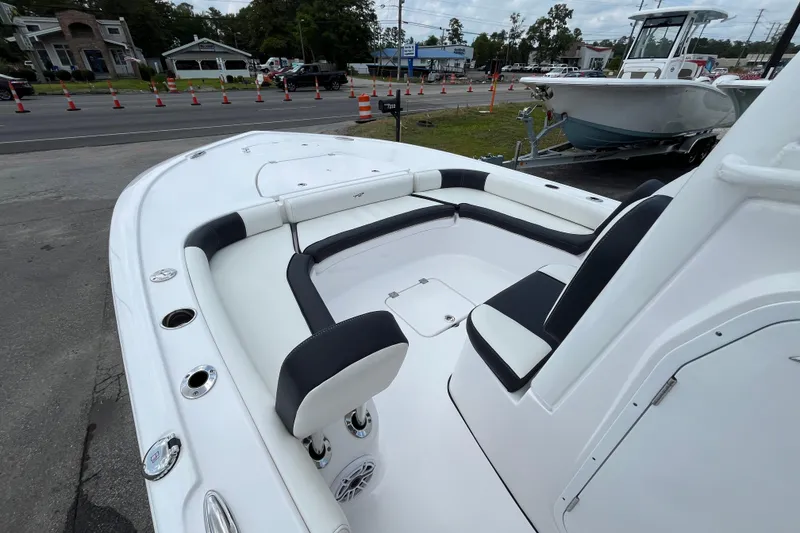Slide: The Image of 2023 Tidewater 2500 Carolina Bay boat interior with seating and storage compartments. - 14