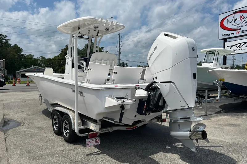 Slide: The Image of 2023 Tidewater 2500 Carolina Bay boat with Mercury engine on trailer. - 2
