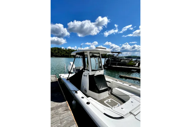 Slide: The Image of 2023 Tidewater 2500 Carolina Bay boat docked on a sunny day with blue skies. - 24