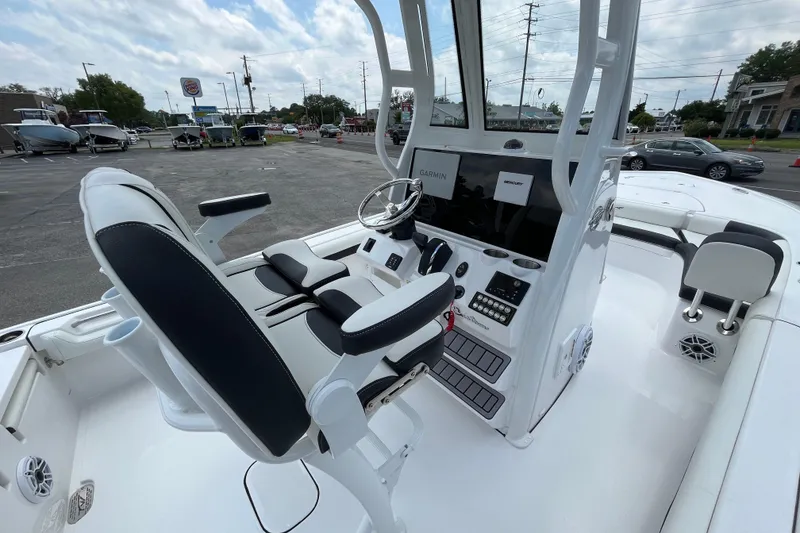 Slide: The Image of 2023 Tidewater 2500 Carolina Bay boat interior with modern helm and seating. - 8