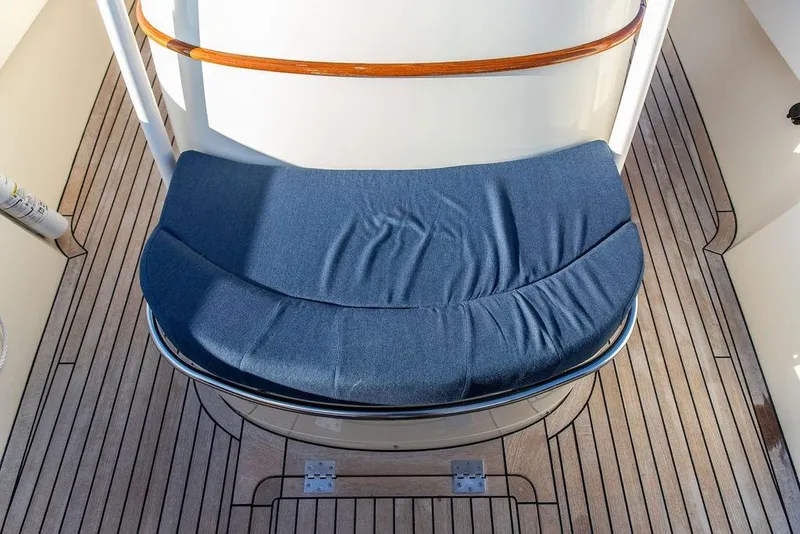 Slide: The Image of Hinckley Talaria 29C 2002 boat interior with blue seating on open water. - 18