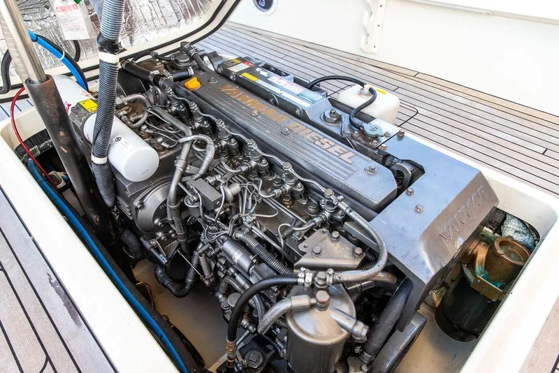 Slide: The Image of Hinckley Talaria 29C 2002 boat with wooden detail and American flag in background. - 29