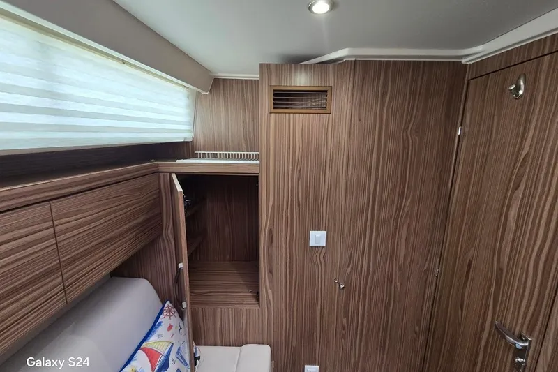Slide: The Image of Interior of 2019 Greenline 40 yacht with wood paneling and modern design. - 14