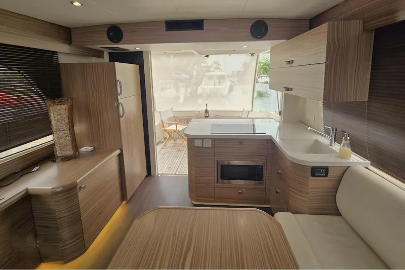Slide: The Image of Luxurious interior of 2019 Greenline 40 yacht with modern kitchen and seating area. - 15