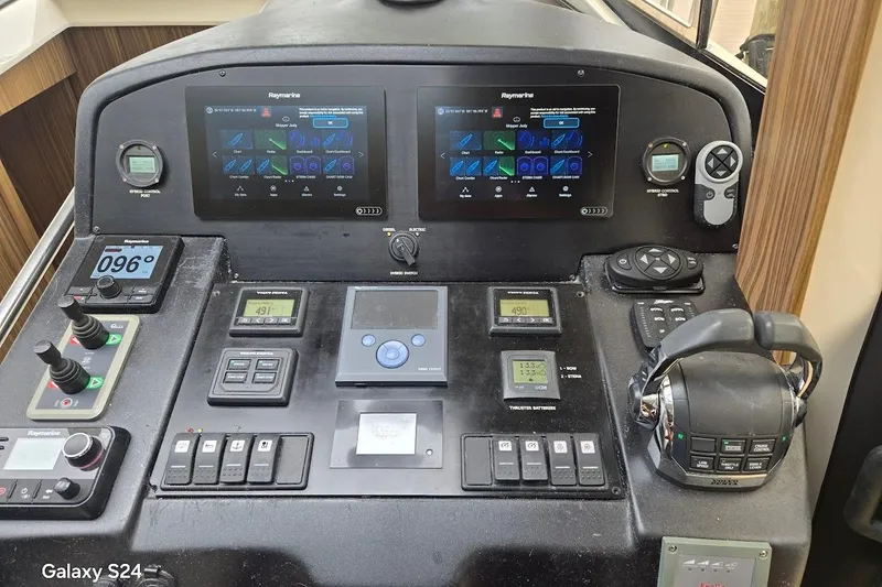 Slide: The Image of Control panel of a 2019 Greenline 40 yacht with advanced navigation systems. - 6