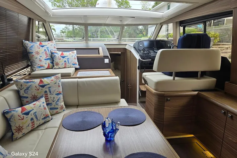 Slide: The Image of Luxurious interior of 2019 Greenline 40 yacht with nautical-themed decor and modern helm. - 8