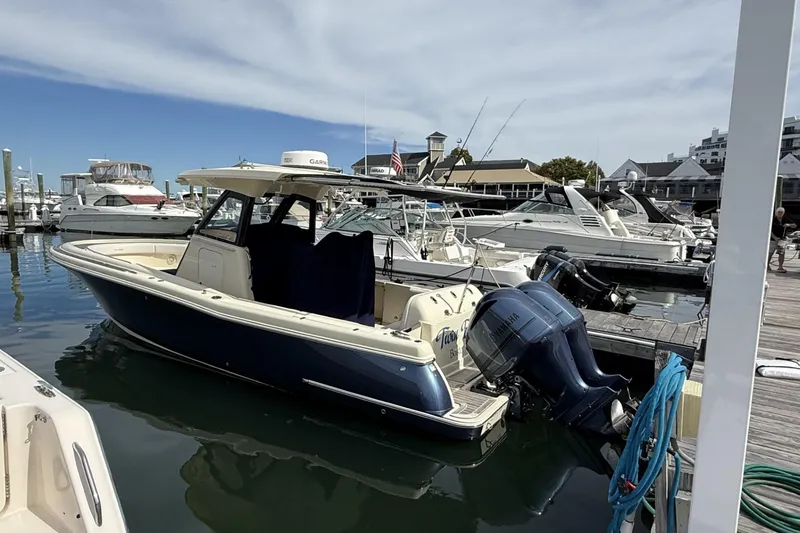 The Image of 2019 Chris-Craft Catalina 30 docked at marina with other boats. - 1