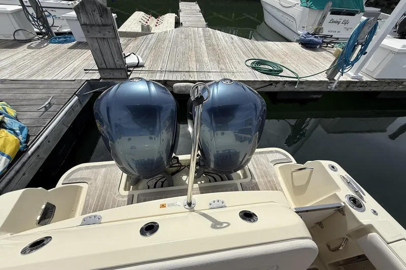 Slide: The Image of 2019 Chris-Craft Catalina 30 with dual outboard engines docked at marina. - 14