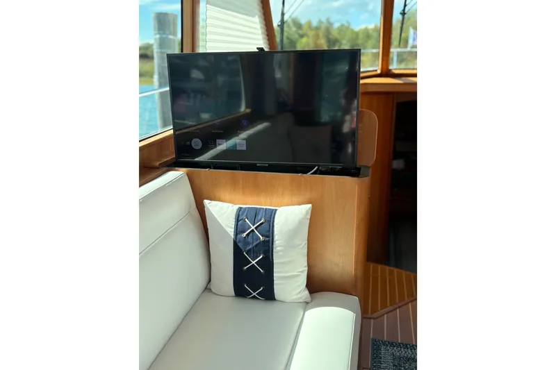 Slide: The Image of Interior of 2023 Sabre 45 Salon Express, featuring elegant wood finish and comfortable seating. - 10