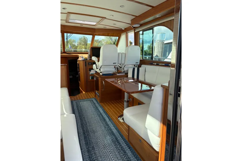 Slide: The Image of Interior of 2023 Sabre 45 Salon Express yacht with elegant seating and wooden flooring. - 12
