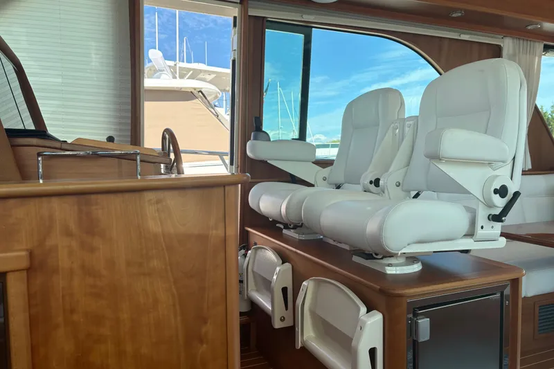 Slide: The Image of Interior of 2023 Sabre 45 Salon Express yacht with elegant seating and wooden finishes. - 15