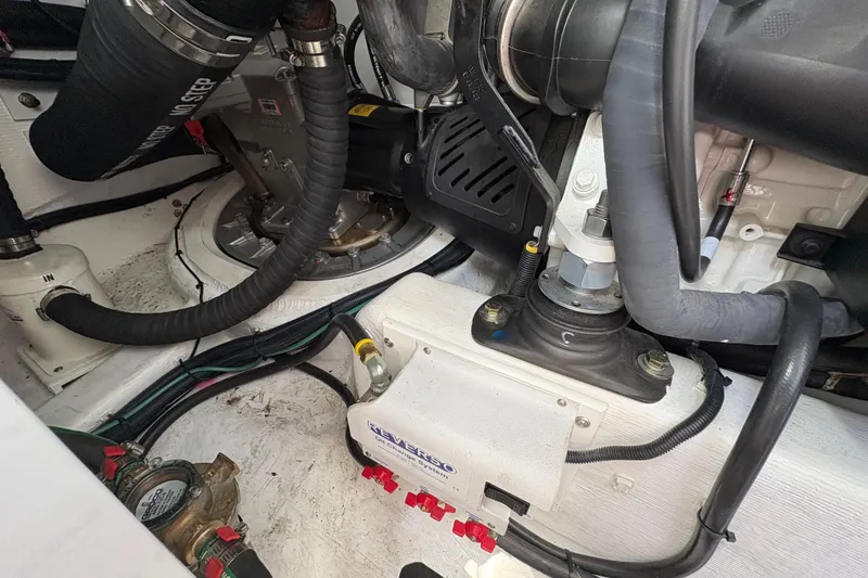 Slide: The Image of Engine room of 2023 Sabre 45 Salon Express with visible mechanical components. - 47