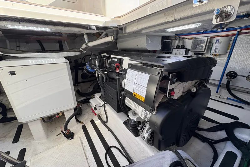 Slide: The Image of Engine room of 2023 Sabre 45 Salon Express, showcasing modern marine machinery and equipment. - 49