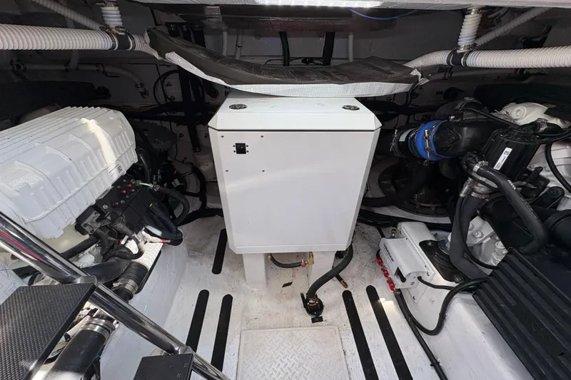 Slide: The Image of Engine room of 2023 Sabre 45 Salon Express yacht, showcasing modern equipment and design. - 50