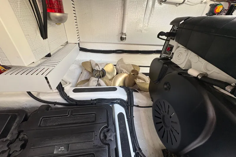 Slide: The Image of Engine room of 2023 Sabre 45 Salon Express with visible machinery and components. - 51