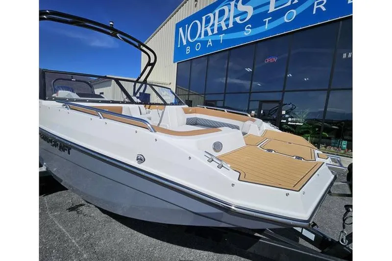 Slide: The Image of 2025 Starcraft SVX 210 OB boat displayed at Norris Lake Boat Store. - 2