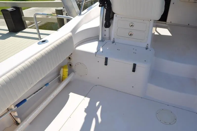 Slide: The Image of 2010 Grady-White Chesapeake 290 boat interior with seating and storage compartments. - 16