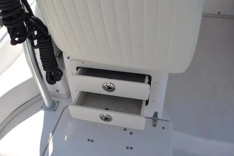 Slide: The Image of Storage drawers on a 2010 Grady-White Chesapeake 290 boat interior. - 18